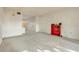 Bright living room featuring carpet flooring, access to other rooms and a view of the exterior at 2727 75Th W St # 1Af, Bradenton, FL 34209