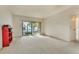 Living room featuring carpet flooring, a sliding glass door to the exterior and bright natural light at 2727 75Th W St # 1Af, Bradenton, FL 34209