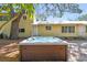 Backyard oasis featuring a large hot tub for relaxing and a lush, green backdrop at 3001 Bay Shore Cir, Sarasota, FL 34234