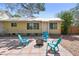Backyard area with outdoor seating, a fire pit, and brick-paver patio at 3001 Bay Shore Cir, Sarasota, FL 34234