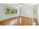 The bedroom features hardwood floors and multiple windows at 3001 Bay Shore Cir, Sarasota, FL 34234