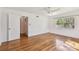 The bedroom features hardwood floors, a ceiling fan, and a large window at 3001 Bay Shore Cir, Sarasota, FL 34234