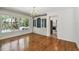 Dining room features hardwood floors, chandelier, and built-in hutch at 3001 Bay Shore Cir, Sarasota, FL 34234