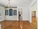 Dining room with hardwood floors, chandelier, and classic built-in at 3001 Bay Shore Cir, Sarasota, FL 34234
