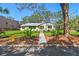Charming home with well-manicured lawn, inviting entrance, and tasteful landscaping at 3001 Bay Shore Cir, Sarasota, FL 34234