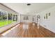 Bright, spacious living room with hardwood floors and large windows at 3001 Bay Shore Cir, Sarasota, FL 34234