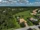 Aerial view shows vast backyard and surrounding community at 306 Country Meadows Way, Bradenton, FL 34212