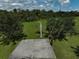 Aerial view of basketball court shows vast backyard at 306 Country Meadows Way, Bradenton, FL 34212