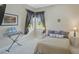 Well-lit bedroom features a keyboard and a lamp at 306 Country Meadows Way, Bradenton, FL 34212