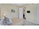 Comfortable bedroom offers relaxing space, with plush pillows and soft carpet at 306 Country Meadows Way, Bradenton, FL 34212