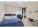 Well-lit bedroom features a comfortable bed, dresser, and desk area at 306 Country Meadows Way, Bradenton, FL 34212