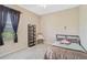 Cozy bedroom features a comfortable bed and a charming accent chair at 306 Country Meadows Way, Bradenton, FL 34212