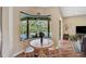 Bright breakfast nook offers pool view from bay window and comfortable seating at 306 Country Meadows Way, Bradenton, FL 34212