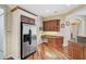 Spacious kitchen boasts stainless steel appliances and hardwood floors at 306 Country Meadows Way, Bradenton, FL 34212