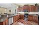 Well-equipped kitchen features stainless steel appliances and granite countertops at 306 Country Meadows Way, Bradenton, FL 34212