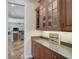 Kitchen features granite counters, wine storage, and ample cabinet space at 306 Country Meadows Way, Bradenton, FL 34212