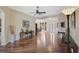 Inviting living room with hardwood floors, neutral decor, and seamless flow to the dining area at 306 Country Meadows Way, Bradenton, FL 34212