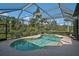 Relax in the screened-in pool with a calming ambiance, creating a private and enjoyable outdoor space at 306 Country Meadows Way, Bradenton, FL 34212
