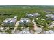 Aerial view of charming two-story homes surrounded by lush greenery and waterways, in a beautiful community at 315 Sapphire Lake Dr # 101, Bradenton, FL 34209