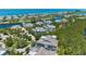 Picturesque aerial view of homes in a waterfront community surrounded by lush greenery at 315 Sapphire Lake Dr # 101, Bradenton, FL 34209