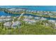 Scenic aerial view of a beautiful community with homes nestled by waterways and lush greenery, offering serene living at 315 Sapphire Lake Dr # 101, Bradenton, FL 34209