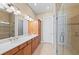 Spacious bathroom features double vanity with ample storage and a separate glass enclosed shower at 315 Sapphire Lake Dr # 101, Bradenton, FL 34209
