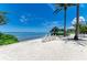 Beautiful white sand beach with waterfront access and chairs for enjoying the view at 315 Sapphire Lake Dr # 101, Bradenton, FL 34209
