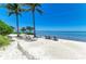 Picturesque beach with lounge chairs and a beautiful ocean view, perfect for relaxation at 315 Sapphire Lake Dr # 101, Bradenton, FL 34209