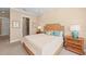 Comfortable bedroom features wicker bed frame, en suite bath access, and tasteful neutral decor at 315 Sapphire Lake Dr # 101, Bradenton, FL 34209