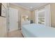 Bright and airy bedroom with white trim, neutral walls, and carpeted floors at 315 Sapphire Lake Dr # 101, Bradenton, FL 34209