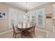 Bright breakfast nook with large windows and plantation shutters, seating four at 315 Sapphire Lake Dr # 101, Bradenton, FL 34209