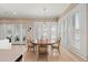 Bright breakfast nook with large windows and plantation shutters, seating four at 315 Sapphire Lake Dr # 101, Bradenton, FL 34209