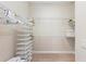 Spacious walk-in closet featuring wire shelving and carpeted floors at 315 Sapphire Lake Dr # 101, Bradenton, FL 34209