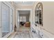 Bright entryway with tile floors, console table, and mirror at 315 Sapphire Lake Dr # 101, Bradenton, FL 34209