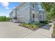 Charming townhome with a two-car garage and landscaped front yard, showcasing modern architecture at 315 Sapphire Lake Dr # 101, Bradenton, FL 34209