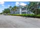 Charming two-story home featuring a screened-in porch, tropical landscaping, and a peaceful setting in this lovely community at 315 Sapphire Lake Dr # 101, Bradenton, FL 34209