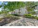 Charming two-story home featuring lush landscaping and well-maintained sidewalks, creating an inviting curb appeal in a quiet setting at 315 Sapphire Lake Dr # 101, Bradenton, FL 34209
