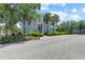 Charming two-story home featuring tropical landscaping, offering a serene and inviting curb appeal in this lovely community at 315 Sapphire Lake Dr # 101, Bradenton, FL 34209