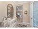 Elegant foyer with a decorative console table, mirror, and view to the open living space at 315 Sapphire Lake Dr # 101, Bradenton, FL 34209