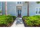 Inviting front entrance with lush landscaping and a charming pathway leading to the front door at 315 Sapphire Lake Dr # 101, Bradenton, FL 34209