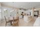 Open kitchen and breakfast nook area with tile floors and bright white cabinets at 315 Sapphire Lake Dr # 101, Bradenton, FL 34209