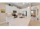 Bright white kitchen with stainless steel appliances and center island with counter seating at 315 Sapphire Lake Dr # 101, Bradenton, FL 34209