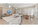 Bright kitchen with an island, stainless steel appliances, and seamless connection to the living area at 315 Sapphire Lake Dr # 101, Bradenton, FL 34209