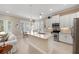 Stylish kitchen with stainless appliances, white cabinets, and an open layout to the living area at 315 Sapphire Lake Dr # 101, Bradenton, FL 34209