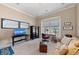 Bright office space features a desk by the window, sofa, TV, and attractive nautical decor at 315 Sapphire Lake Dr # 101, Bradenton, FL 34209