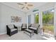 Screened-in patio features tile flooring, stylish furniture, and a ceiling fan for comfortable outdoor living at 315 Sapphire Lake Dr # 101, Bradenton, FL 34209