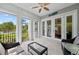 The covered patio includes stylish seating, tiled floors, and ample natural light, ideal for relaxing outdoors at 315 Sapphire Lake Dr # 101, Bradenton, FL 34209