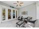 The screened-in patio features tile flooring, ample seating, and a ceiling fan for comfortable outdoor enjoyment at 315 Sapphire Lake Dr # 101, Bradenton, FL 34209