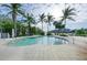 Community pool featuring zero entry, steps into the water, stainless steel handrails, and lounge seating at 315 Sapphire Lake Dr # 101, Bradenton, FL 34209