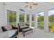 Covered porch with comfortable seating and beautiful views of the lush surroundings at 315 Sapphire Lake Dr # 101, Bradenton, FL 34209